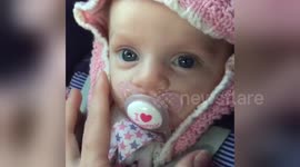 Newsflare Edit - Heartwarming moment, baby gazes into her mums eyes.