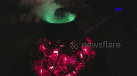 Halloween witches bubbling caldron with skull