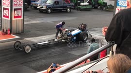 Setting a dragster on fire then doing a burnout
