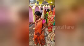 Indian women accidentally worship dustbin during major festival
