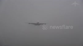 Plane appears from nowhere to land in thick Prague fog
