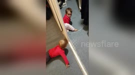 Newsflare Edit - Baby twins discovering hide and seek
