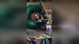 Slide topples over as grandad tries to show how safe it is