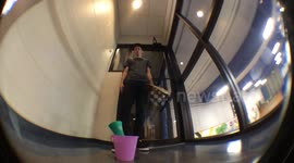 Office workers perfect their ping pong ball throwing skills