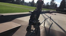 Dad does skateboarding trick while pushing baby in stroller