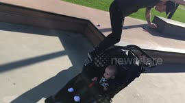 Awesome skateboarding dad does tricks while pushing son's stroller