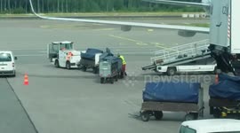 Reckless baggage handler throwing bags