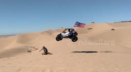 Cameraman nearly gets crushed by side-by-side