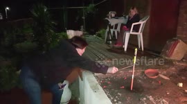Family enjoying a small bonfire and fireworks times hard not going out