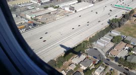 Airplane shadow swooping in for a landing