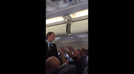 Air hostess struggles through safety routine as football fans make her laugh