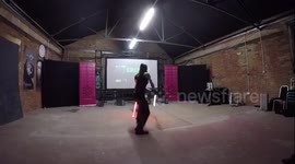 Esaam Rayn  teaching LED Saber Duelling at the Sci Fi London Experiment