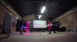 Esaam Rayn  With two LED Sabers Dueling at the Sci Fi London Experiment