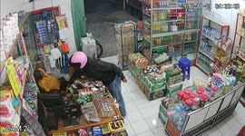Sleepy shopkeeper dozes through robbery in Indonesia