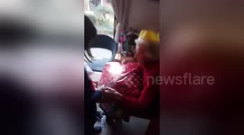 Newsflare Edit - Child helps grandma open her Christmas present