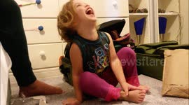 Three-year-old is super excited about present