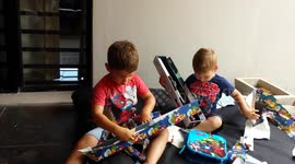 Kids opening Christmas gifts