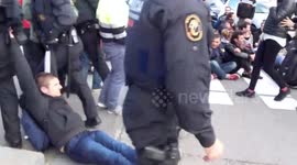 Police drag Catalan protesters along ground
