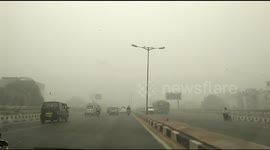 Drive shot through New Delhi street as city chokes under smog