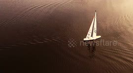 Fish jumps over yacht and hits sail, but it is what it really seems?