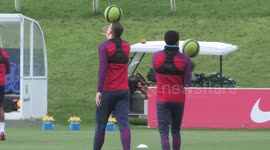 Jesse Lingard and Phil Jones show off circus skills during England training