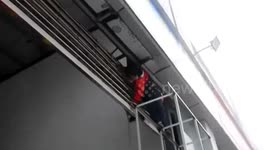 Girl gets hand stuck in shop shutters