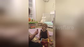 Baby is amazed by disappearing-ball magic trick