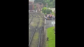 Child been swung over railway track