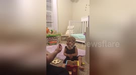 Baby is amazed by magic trick