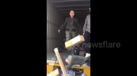 Couriers kick packages off lorry in China