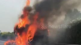 Lorry loaded with thousands of packages bursts into flames