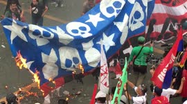 Anti-Trump protesters burn US flag in Manila