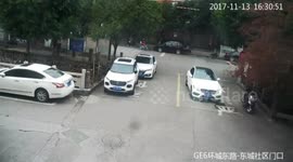 Passers-by rescue schoolboy trapped under car
