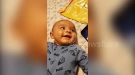 Baby reacts to hearing own voice for first time