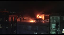 Firefighters tackle blaze on roof of London building