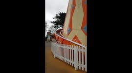 child coming down slide