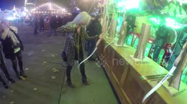 Nicola Hughes tires to shoot bow at Winter Wonderland