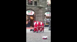 Singing Santa’s in London Festivities To Make You Laugh