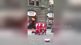Newsflare Edit - Singing Santa’s in London Festivities To Make You Laugh