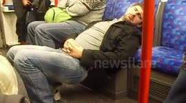 Man takes a very odd nap on the London Underground