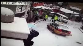 Out-of-control taxi crashes into police officer in snow