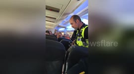 Newsflare Edit - Drunk glasgow passenger threatens police officer when diverted to Bristol. Emergency landing