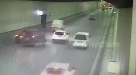 Jaw-dropping moment minibus drives on two wheels in busy tunnel