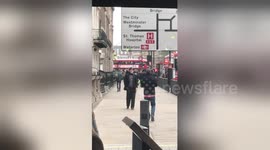 Newsflare Edit - Man walking backwards in London for no apparent reason (near parliament house)