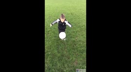 Child doing football tricks and skills