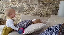 Twins making each other laugh