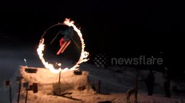 Skier does switch backflip through flames