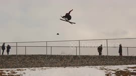 Skier lands huge trick then crashes into cameraman