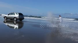 Skier takes skis to beach, invents new sport