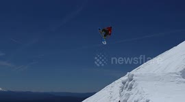 Snowboarder flips into oblivion